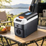 Black & White Portable Fridge with Orange Latches — camping view